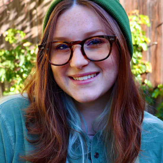 A person wearing Tart Optical Frames.