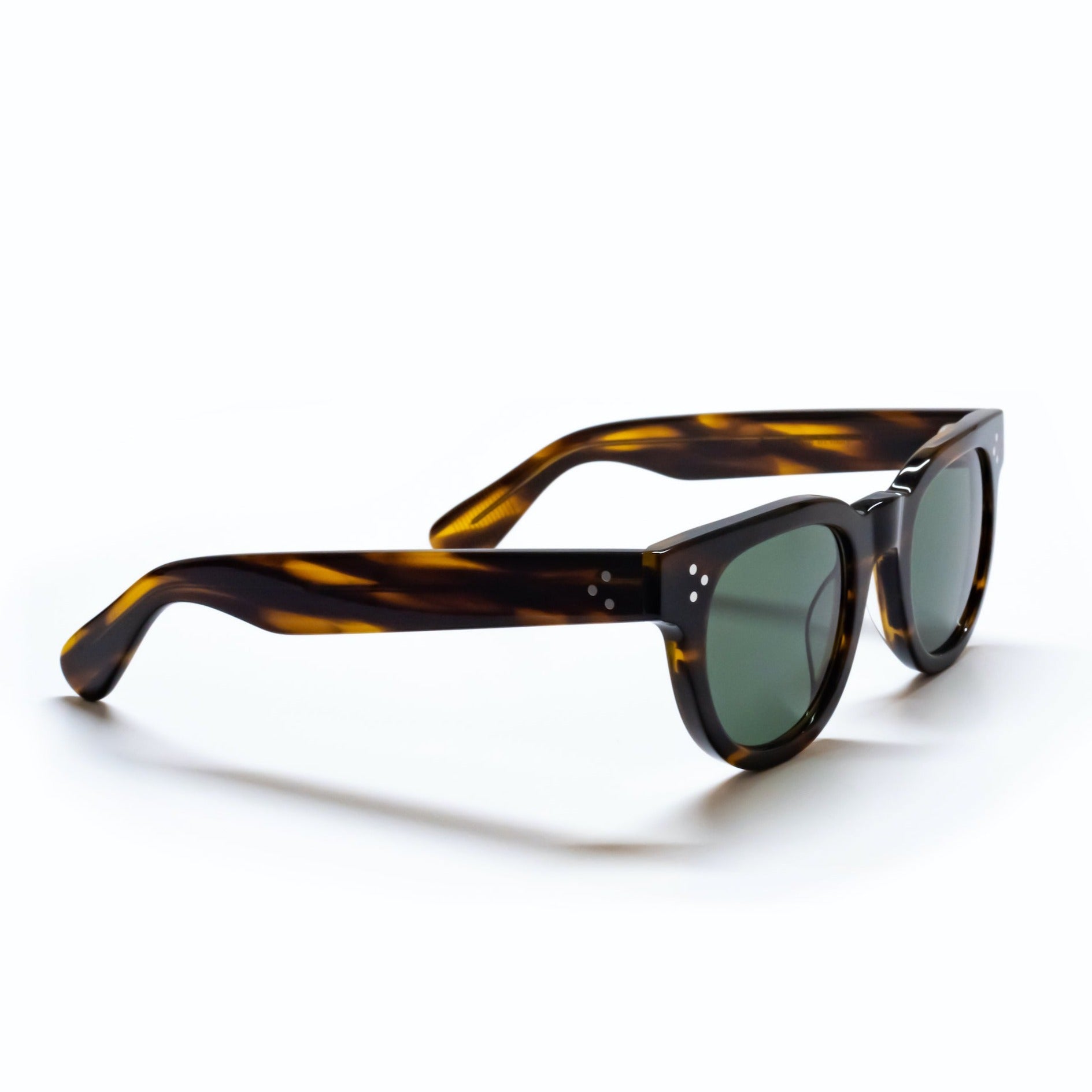 A side view of the FDR Sunglasses frame. It's the Demi Amber variant.
