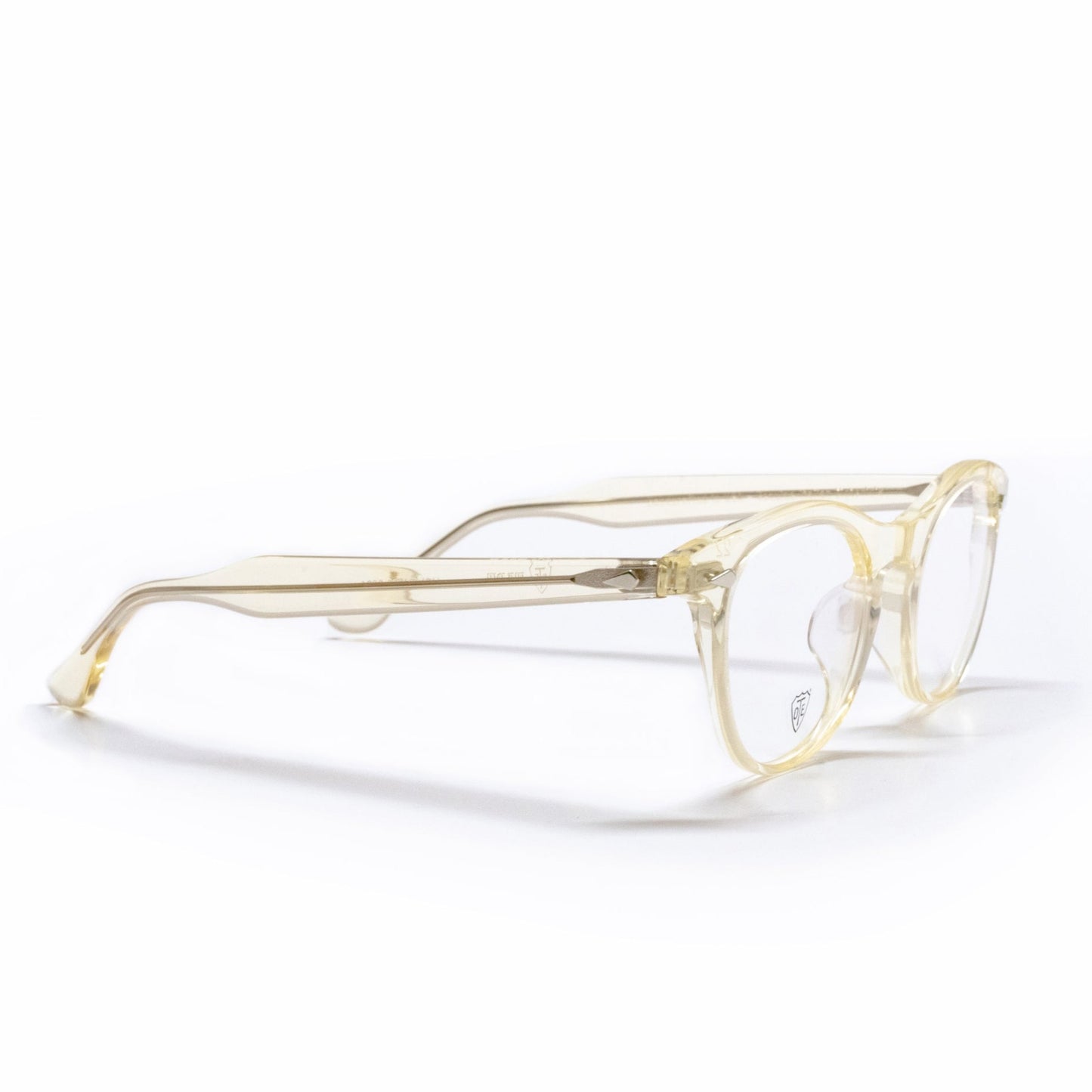 A side view of the champaign Leading Liz low bridge fit frame, the luxury cat-eye fashion glasses.