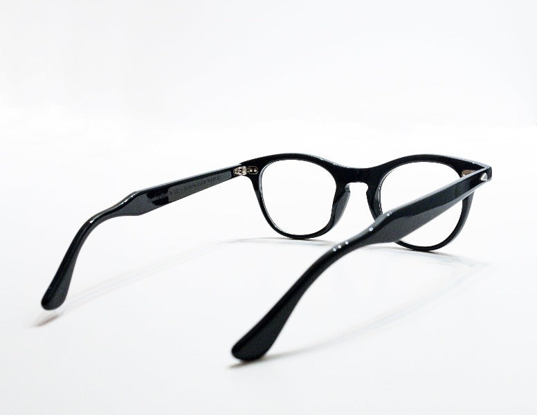 A back view of the glossy black Leading Liz frame, the luxury cat-eye fashion glasses.